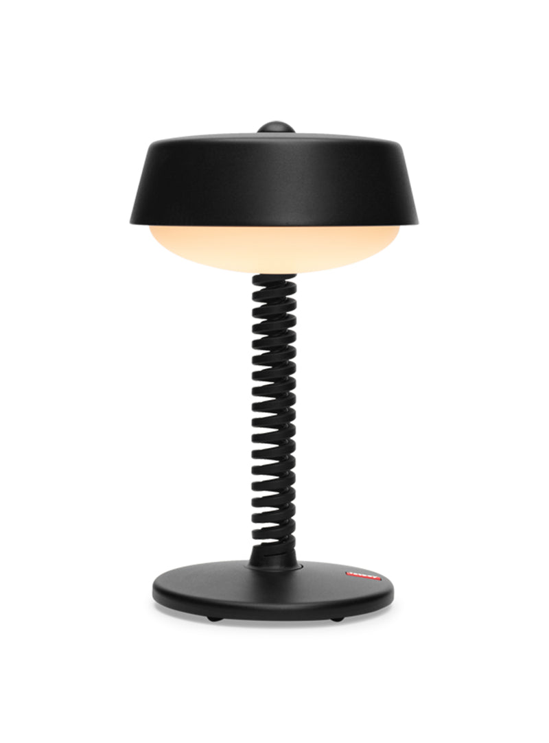 Fatboy Bellboy table lamp in anthracite, cordless and dimmable with rechargeable LED light, perfect for indoor and outdoor use.