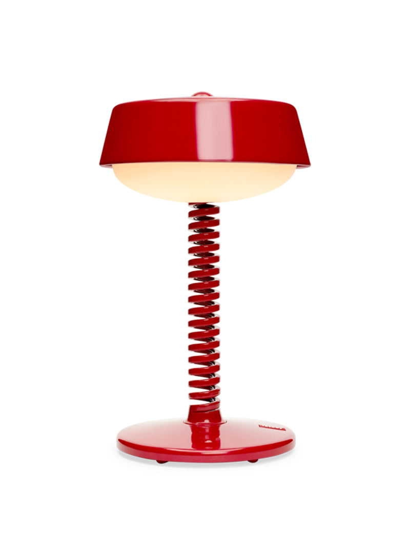 Fatboy Bellboy table lamp in red, cordless and dimmable with rechargeable LED light, perfect for indoor and outdoor use.