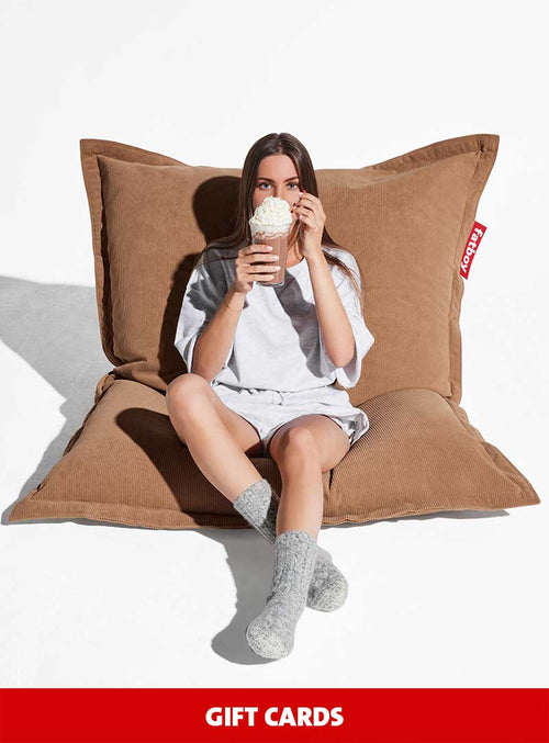 E-gift card option from Fatboy, showcasing a vibrant selection of home decor items and iconic bean bags for a personalized gift experience.