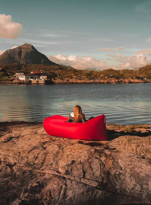 Fatboy Lamzac, an inflatable air lounger with easy setup, perfect for outdoor lounging in Canadian gardens, beaches, and festivals.