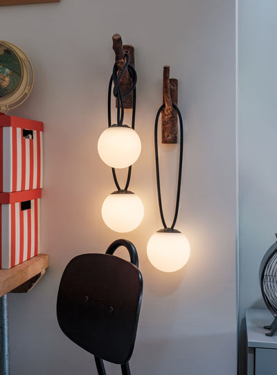 Set of 3 Bolleke Mini lamps by Fatboy hanging outdoors for ambient evening lighting.