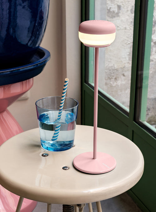 Cheerio is a sleek, cordless metal table lamp that brings refined ambience indoors or outdoors, combining modern design with everyday durability.