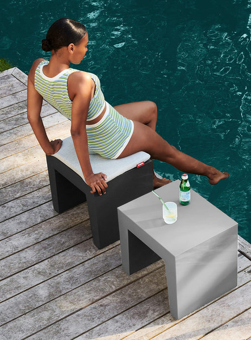 Concrete Seat by Fatboy, multifunctional as a stool or table, with a concrete look and plastic design, ideal for Canadian indoor or outdoor use.
