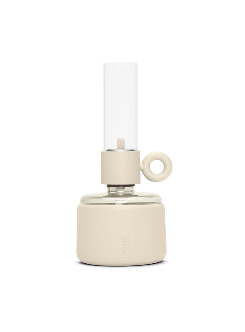 Fatboy Flamtastique XS in cream color, modern oil lamp with dimmable light and silicone finish, perfect for indoor and outdoor ambiance.