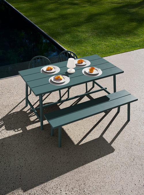 A versatile 4–5 seat outdoor set with Fred’s table and chairs or benches in Dark Sage. Durable aluminum, smart design, made for every season.