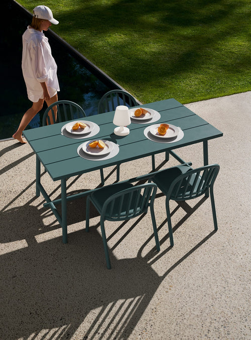 Modern outdoor dining set for 4–5, combining Fred’s table with chairs. Durable, stylish, and weather-resistant.