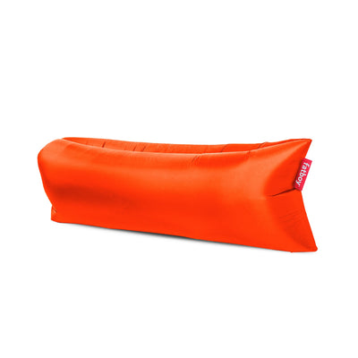 Fatboy Lamzac in Tulip Orange color: inflatable air lounger, easy to fill, portable, UV-resistant, perfect for outdoor relaxation in Canada.