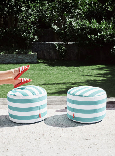 Fatboy Point Olefin ottoman, a durable and waterproof outdoor footstool with UV-resistant fabric, perfect for Canadian patios and gardens.