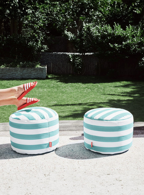 Fatboy Point Olefin ottoman, a durable and waterproof outdoor footstool with UV-resistant fabric, perfect for Canadian patios and gardens.