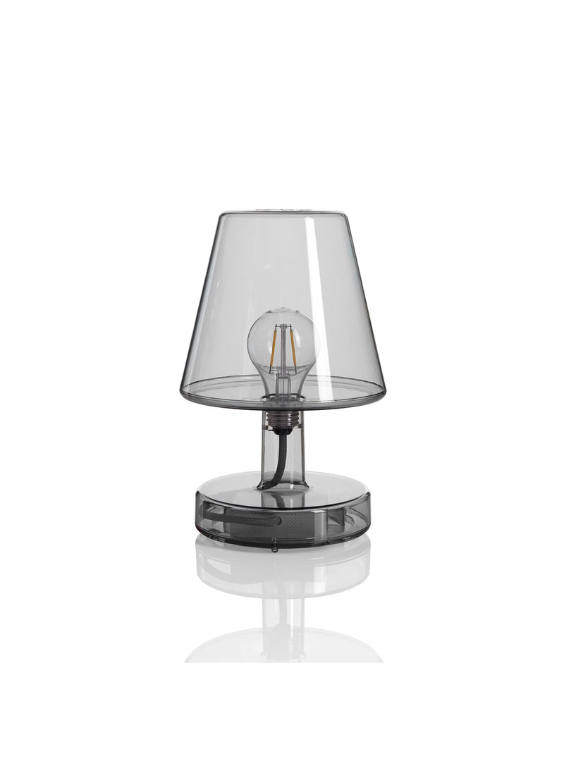 Fatboy Transloetje table lamp in grey transparent color, featuring a wireless, touch-controlled LED light with 3 brightness settings for modern Canadian interiors.