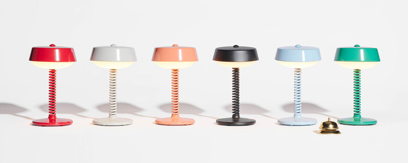 Contemporary Bellboy lamp designed for both indoor and outdoor use, featuring touch-sensitive brightness adjustment and multiple charging options.