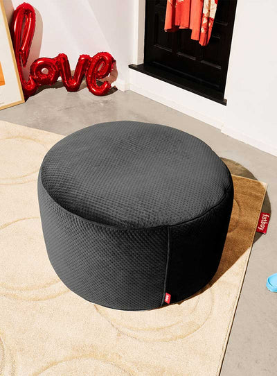 Enhance your relaxation with the Point Large Royal Velvet pouf collection by Fatboy. Meticulously crafted from recycled materials, these multifunctional ottomans and footrests provide eco-friendly opulence.