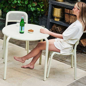 Cool bistro chairs. But what can you serve that dinner  for two on? On Toní Bistreau, of course. This lightweight  aluminum bistro table will enable you to set up your own  private restaurant.